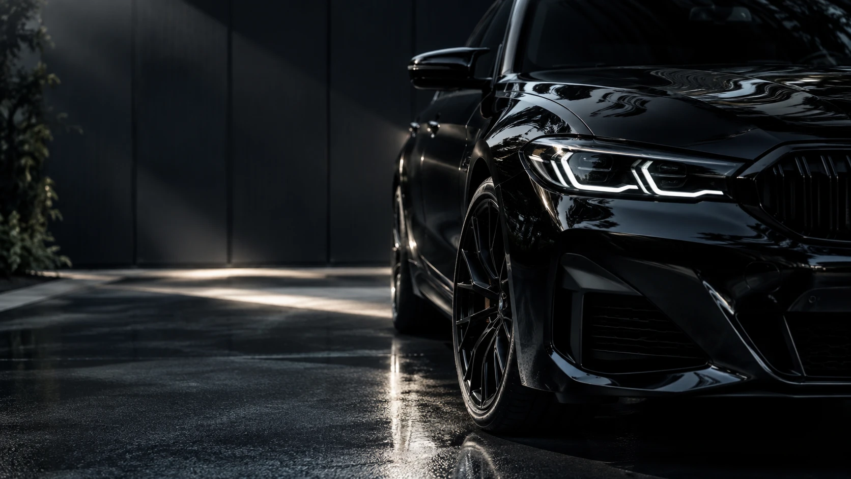 BMW detailed by PPA Detailing, lit dramatically in a dark studio